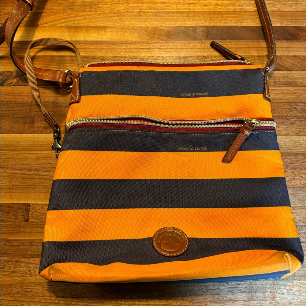 Dooney and Bourke navy and gold striped purse